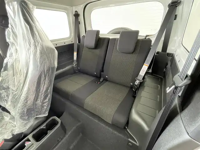 スズキ ジムニー XC 大分県 2024(令6)年 0.1千km ピュアホワイトP 登録済未使用車/社外７型ナビ　AVN-LBS01/デュアルブレーキセンサーサポート/誤発進抑制機能/車線逸脱警報/ふらつき警報/ハイビームアシスト/先行車発信お知らせ機能/標識認識機能/シートヒーター/スマートキー×２/ヘッドランプウォッシャー/電動格納ウィンカーミラー/フォグランプ/ステアリングリモコン