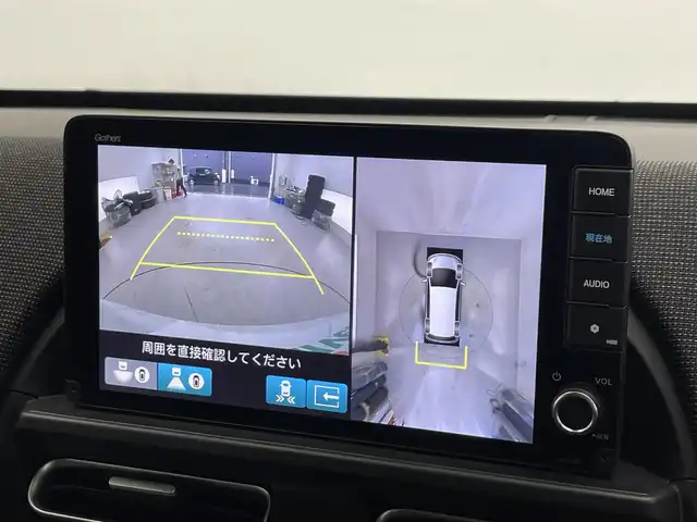 ホンダ フリード ハイブリット e:HEV AIR EX 滋賀県 2024(令6)年 1.3万km プラチナホワイトパール 純正9インチナビ/【Bluetooth/フルセグTV/Apple CarPlay/Android Auto】/両側パワースライドドア/全方位カメラ/ホンダセンシング/・衝突軽減ブレーキ（CMBS）/・先行車発進お知らせ機能/・歩行者事故低減ステアリング/・路外逸脱抑制機能/・標識認識機能/・渋滞追従機能付アダプティブクルーズコントロール/・車線維持支援システム/・トラフィックジャムアシスト/・ブラインドスポットインフォメーション/・誤発進抑制機能/・後方誤発進抑制機能/・近距離衝突軽減ブレーキ/・急アクセル抑制機能/・パーキングセンサーシステム/・後退出庫サポート/・オートハイビーム/・アダプティブドライビングビーム/ハーフレザーシート/D/Nシートヒーター/LEDヘッドライト/ビルトインETC/電動パーキングブレーキ/オートブレーキホールド/純正フロアマット/プッシュスタート/スマートキー/ステアリングリモコン/後席ロールサンシェード