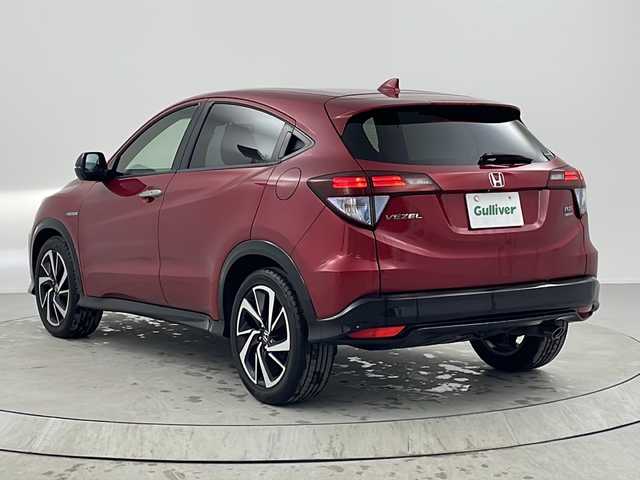 ホンダ ヴェゼル ハイブリッド RS ホンダセンシング 熊本県 2017(平29)年 7万km プレミアムクリスタルレッドM 【 Honda SENSING 】/・衝突軽減ブレーキ 〈CMBS〉/・歩行者事故低減ステアリング/・ACC 〈アダプティブ・クルーズ・コントロール〉/・LKAS 〈車線維持支援システム〉/・路外逸脱抑制機能/・誤発進抑制機能/・先行車発進お知らせ機能/・標識認識機能/ワンオーナー/純正メモリーナビ/フルセグテレビ/バックカメラ/Bluetooth/DVD再生可能/ハーフレザーシート/社外ドライブレコーダー（フロント）/オートライト/ＬＥＤヘッドライト/ビルトインETC/スマートキー3個/純正フロアマット/純正18ＡＷ/D・N席シートヒーター