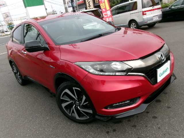 ホンダ ヴェゼル ハイブリッド RS ホンダセンシング 大分県 2017(平29)年 7万km プレミアムクリスタルレッドM 【 Honda SENSING 】/・衝突軽減ブレーキ 〈CMBS〉/・歩行者事故低減ステアリング/・ACC 〈アダプティブ・クルーズ・コントロール〉/・LKAS 〈車線維持支援システム〉/・路外逸脱抑制機能/・誤発進抑制機能/・先行車発進お知らせ機能/・標識認識機能/ワンオーナー/純正メモリーナビ/フルセグテレビ/バックカメラ/Bluetooth/DVD再生可能/ハーフレザーシート/社外ドライブレコーダー（フロント）/オートライト/ＬＥＤヘッドライト/ビルトインETC/スマートキー3個/純正フロアマット/純正18ＡＷ/D・N席シートヒーター