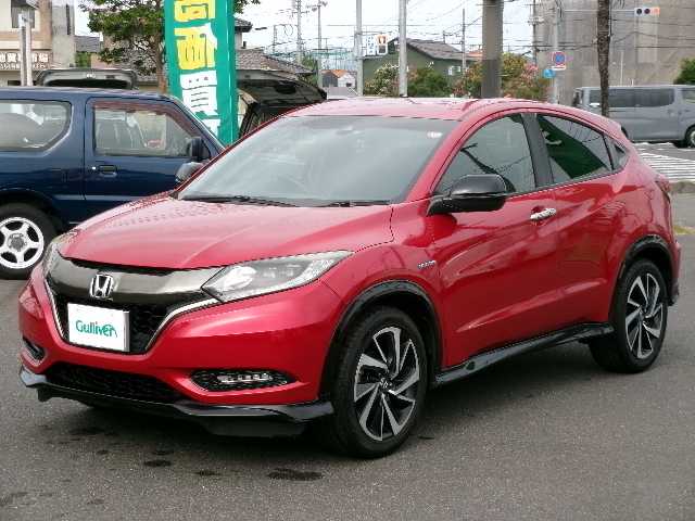ホンダ ヴェゼル ハイブリッド RS ホンダセンシング 大分県 2017(平29)年 7万km プレミアムクリスタルレッドM 【 Honda SENSING 】/・衝突軽減ブレーキ 〈CMBS〉/・歩行者事故低減ステアリング/・ACC 〈アダプティブ・クルーズ・コントロール〉/・LKAS 〈車線維持支援システム〉/・路外逸脱抑制機能/・誤発進抑制機能/・先行車発進お知らせ機能/・標識認識機能/ワンオーナー/純正メモリーナビ/フルセグテレビ/バックカメラ/Bluetooth/DVD再生可能/ハーフレザーシート/社外ドライブレコーダー（フロント）/オートライト/ＬＥＤヘッドライト/ビルトインETC/スマートキー3個/純正フロアマット/純正18ＡＷ/D・N席シートヒーター