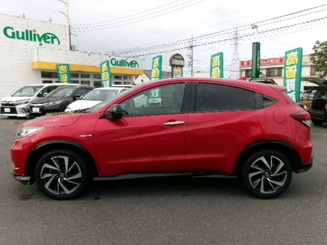 ホンダ ヴェゼル ハイブリッド RS ホンダセンシング 大分県 2017(平29)年 7万km プレミアムクリスタルレッドM 【 Honda SENSING 】/・衝突軽減ブレーキ 〈CMBS〉/・歩行者事故低減ステアリング/・ACC 〈アダプティブ・クルーズ・コントロール〉/・LKAS 〈車線維持支援システム〉/・路外逸脱抑制機能/・誤発進抑制機能/・先行車発進お知らせ機能/・標識認識機能/ワンオーナー/純正メモリーナビ/フルセグテレビ/バックカメラ/Bluetooth/DVD再生可能/ハーフレザーシート/社外ドライブレコーダー（フロント）/オートライト/ＬＥＤヘッドライト/ビルトインETC/スマートキー3個/純正フロアマット/純正18ＡＷ/D・N席シートヒーター