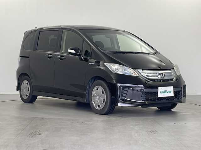 ホンダ フリード ハイブリット ジャストセレクション 栃木県 2013(平25)年 10.7万km プレミアムスパークルブラックパール 社外SDナビ/（BT/AM/FM/フルセグ/CD/DVD）/クルーズコントロール/ETC/横滑り防止/両側パワースライドドア/電動格納ミラー/ステアリングスイッチ/純正フロアマット/バックカメラ