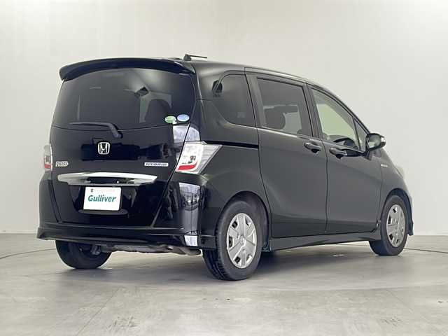 ホンダ フリード ハイブリット ジャストセレクション 栃木県 2013(平25)年 10.7万km プレミアムスパークルブラックパール 社外SDナビ/（BT/AM/FM/フルセグ/CD/DVD）/クルーズコントロール/ETC/横滑り防止/両側パワースライドドア/電動格納ミラー/ステアリングスイッチ/純正フロアマット/バックカメラ