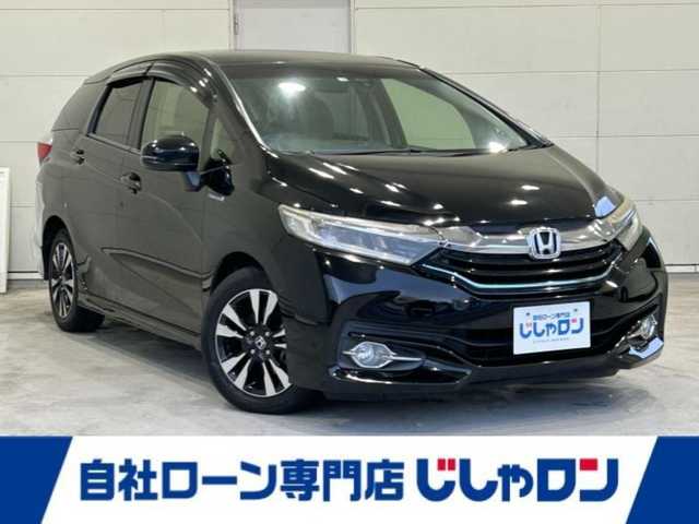ホンダ シャトル ハイブリッド X 沖縄県 2016(平28)年 7.3万km クリスタルブラックパール (株)IDOMが運営する【じしゃロンコザ店】の自社ローン専用車両になりますこちらは現金またはオートローンご利用時の価格です。自社ローンご希望の方は別途その旨お申付け下さい/純正ナビ　/バックカメラ　/ＥＴＣ　/衝突軽減ブレーキ　/クルーズコントロール　/コーナーセンサー　/パドルシフト　/ハーフレザーシート　/純正アルミホイール　/プッシュスタート　/スマートキー　/オートライト
