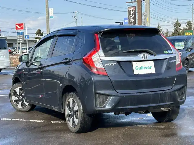 ホンダ フィット ハイブリット Fパッケージ 道南・函館 2016(平28)年 7.8万km ミッドナイトブルービームM /社外ナビ//フルセグTV//寒冷地仕様//バックカメラ//ETC//プッシュスタート//スマートキー//純正フロアマット//横滑り防止装置//ドアバイザー//ウィンカーミラー//純正ホイールキャップ//アイドリングストップ