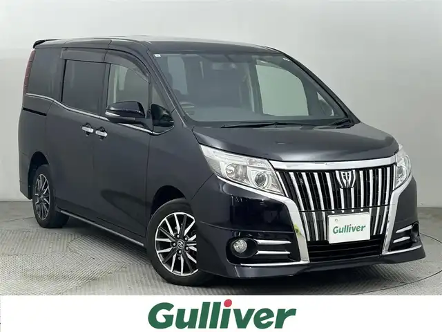 トヨタ エスクァイア Gi 道央・札幌 2015(平27)年 9.4万km スパークリングブラックパールクリスタルシャイン ・４WD/・寒冷地仕様/・車種専用BIG Xプレミアム10インチナビ/・CD/DVD/SD/BT/フルセグ/・バックカメラ/・ビルトインETC/・レーダー探知機/・クルーズコントロール/・オートマチックハイビーム/・LEDヘッドライト/・フォグランプ/・合皮シート/・両側パワースライドドア/・前席シートヒーター/・ステアリングスイッチ/・アイドリングストップ/・純正16インチAW/・社外15インチAW冬タイヤ積込/・純正エンジンスターター/・スペアキー/・純正フロアマット/・取扱説明書/・保証書