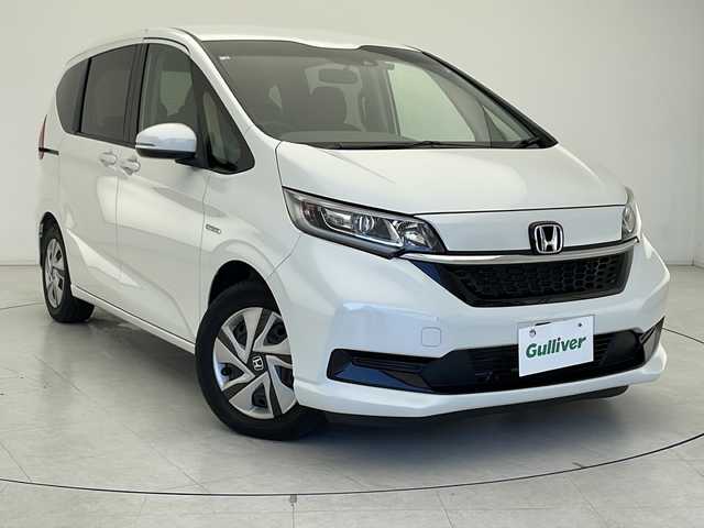 ホンダ フリード ハイブリット G ホンダセンシング 千葉県 2021(令3)年 3.5万km プラチナホワイトパール 社外SDナビ【MDV-D308BT】/　(ワンセグTV/Bluetooth/FM/AM/CD/DVD/USB)/ホンダセンシング/　衝突軽減ブレーキ/アダティブクルーズコントロール/　先行車発進お知らせ/路外逸脱抑制/　レーンキープアシスト/標識認識機能/ドライブレコーダー(前方のみ)【DC-XR1】/スペアキー(1本)/ETC/両側パワースライドドア/バックカメラ/ステアリングスイッチ/LEDヘッドライト/社外フロアマット/電動格納ウィンカーミラー/エアバッグ(W)/オートライト/プッシュスタート