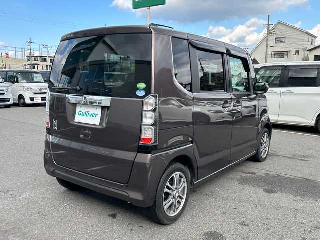 ホンダ Ｎ ＢＯＸ G Lパッケージ 大阪府 2014(平26)年 4.7万km プレミアムブロンズパール 社外ナビ(BT/CD/DVD/SD/USB/ワンセグ)/バックカメラ/衝突被害軽減システム/両側パワースライドドア/純正アルミホイール/純正フロアマット/アイドリングストップ/フルフラットシート/チップアップシート/カーテンエアバック/プッシュスタートボタン/ハロゲンヘッドライト