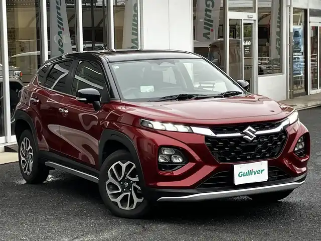 スズキ フロンクス 山口県 2024(令6)年 0.8万km 赤Ⅱ 4WD/デュアルセンサー/　ブレーキサポートII/純正ナビ＆フルセグTV/　＆全方位モニター/純正LEDヘッドライト/純正16インチアルミ/フロントシートヒーター/ヘッドアップディスプレイ/おくだけ充電/レーンキープアシスト/衝突被害軽減ブレーキ/アダプティブ/　クルーズコントロール/パドルシフト/オートハイビーム