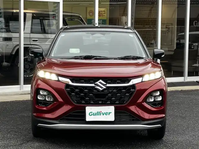 スズキ フロンクス 山口県 2024(令6)年 0.8万km 赤Ⅱ 4WD/デュアルセンサー/　ブレーキサポートII/純正ナビ＆フルセグTV/　＆全方位モニター/純正LEDヘッドライト/純正16インチアルミ/フロントシートヒーター/ヘッドアップディスプレイ/おくだけ充電/レーンキープアシスト/衝突被害軽減ブレーキ/アダプティブ/　クルーズコントロール/パドルシフト/オートハイビーム