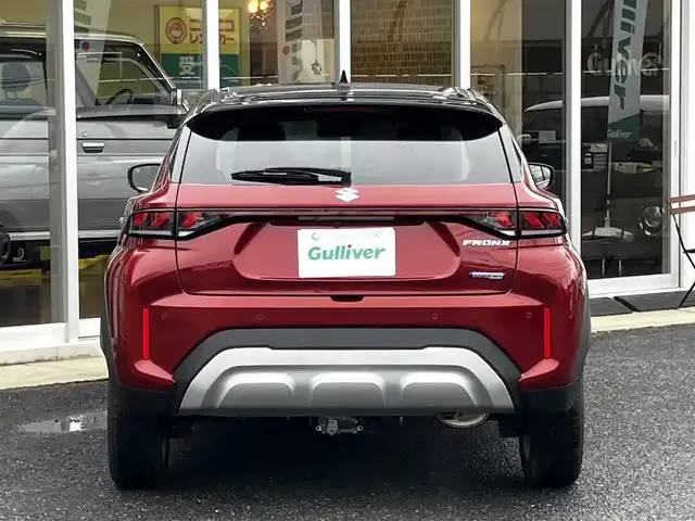 スズキ フロンクス 山口県 2024(令6)年 0.8万km 赤Ⅱ 4WD/デュアルセンサー/　ブレーキサポートII/純正ナビ＆フルセグTV/　＆全方位モニター/純正LEDヘッドライト/純正16インチアルミ/フロントシートヒーター/ヘッドアップディスプレイ/おくだけ充電/レーンキープアシスト/衝突被害軽減ブレーキ/アダプティブ/　クルーズコントロール/パドルシフト/オートハイビーム