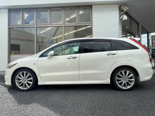ホンダ ストリーム RSZ HDDナビエディション 神奈川県 2009(平21)年 12.9万km プレミアムホワイトパール 純正HDDインターナビ/ DVD/CD/MSV/FM/AM/社外フルセグチューナー/バックカメラ/ETC/リモコンキー/純正フロアマット/オートライト/HIDヘッドライト/フォグランプ/純正１８インチAW/ドアバイザー/保証書/取扱説明書
