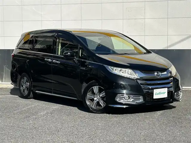 ホンダ オデッセイ ハイブリッド 東京都 2016(平28)年 7万km クリスタルブラックパール ワンオーナー/純正SDナビ/　フルセグTV/SD/CD・DVD/Bluetooth/AM・FM/バックカメラ/アダプティブクルーズコントロール/アイドリングストップ/衝突被害軽減ブレーキ/レーンキープアシスト/横滑り防止装置/純正ビルトインＥＴＣ/純正18インチアルミホイール/純正フロアマット/片側パワースライドドア/ステアリングスイッチ/プッシュスタート/カーテンエアバック/LEDヘッドライト/オートライト/パワーステアリング/パワーウィンドウ/スマートキー/ドアバイザー/保証書/取扱説明書/スペアキー