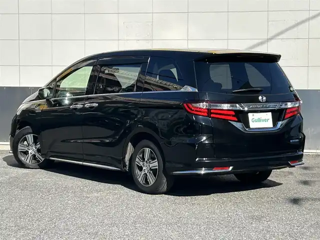 ホンダ オデッセイ ハイブリッド 東京都 2016(平28)年 7万km クリスタルブラックパール ワンオーナー/純正SDナビ/　フルセグTV/SD/CD・DVD/Bluetooth/AM・FM/バックカメラ/アダプティブクルーズコントロール/アイドリングストップ/衝突被害軽減ブレーキ/レーンキープアシスト/横滑り防止装置/純正ビルトインＥＴＣ/純正18インチアルミホイール/純正フロアマット/片側パワースライドドア/ステアリングスイッチ/プッシュスタート/カーテンエアバック/LEDヘッドライト/オートライト/パワーステアリング/パワーウィンドウ/スマートキー/ドアバイザー/保証書/取扱説明書/スペアキー