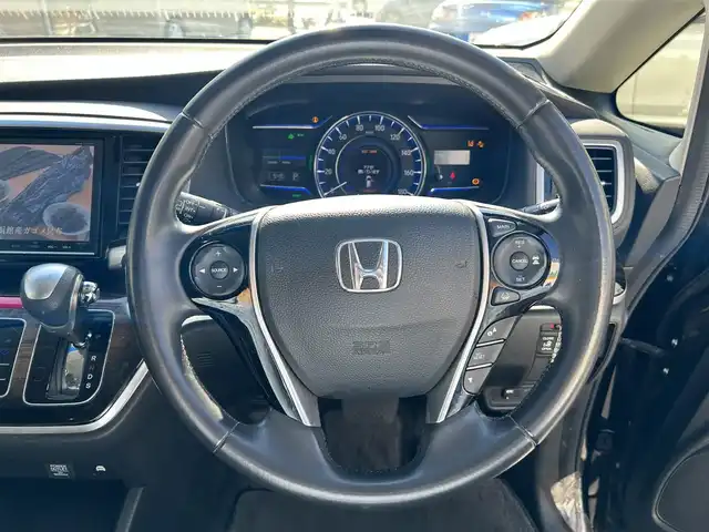 ホンダ オデッセイ ハイブリッド 東京都 2016(平28)年 7万km クリスタルブラックパール ワンオーナー/純正SDナビ/　フルセグTV/SD/CD・DVD/Bluetooth/AM・FM/バックカメラ/アダプティブクルーズコントロール/アイドリングストップ/衝突被害軽減ブレーキ/レーンキープアシスト/横滑り防止装置/純正ビルトインＥＴＣ/純正18インチアルミホイール/純正フロアマット/片側パワースライドドア/ステアリングスイッチ/プッシュスタート/カーテンエアバック/LEDヘッドライト/オートライト/パワーステアリング/パワーウィンドウ/スマートキー/ドアバイザー/保証書/取扱説明書/スペアキー