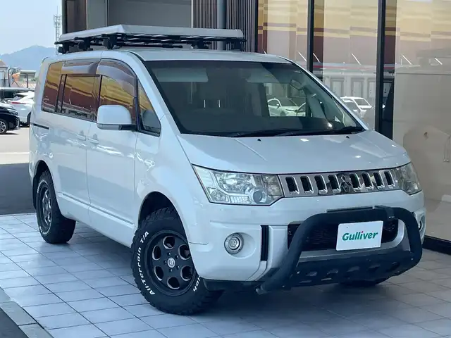三菱 デリカＤ：５ D－Power package 岡山県 2013(平25)年 10万km ウォームホワイトパール 4WD（切り替え式）/アルパインビックX９インチ/　DVD/BT/CD/アルパインフリップダウンモニター/　（PCX-R3300）/フロントドラレコ/両側電動スライドドア/前2席シートヒーター/オールテレーンタイヤ /   225/70/16 ホワイトレター/社外バンパーガード/ルーフキャリア/パワーアウトレット/　12V/120W/ウインカーミラー/コンビステア/パドルシフト/フォグライト