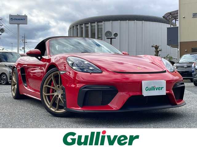 ポルシェ ７１８スパイダー 大阪府 2020(令2)年 1万km ガーズレッド ワンオーナー/ソフトトップオープン/純正ナビ（CD/AM/FM/jukebox/電話）/バックカメラ/ETC2.0/ブルメスターハイエンドサラウンドサウンドシステム/マルチファンクションステアリングホイール/ステアリングヒーター/Race-Tex（レーステックス）ステアリング（赤刺繍）/スマートキー×２/パワーシート/スポーツシートプラス/Race-Tex（レーステックス）×レザーシート/シートヒーター/カラーシートベルト/コントラストカラーステッチ/レザーサンバイザー/カーボンインテリアパッケージ/カーボンドアシルガード/AUTO BLIP/ESC OFF/ESC＋TC　OFF　切り替えボタン/スポーツクロノパッケージ/PASM/スポーツエキゾースト/トラクションコントール/ヒルスタートアシスト/20インチ718CaymanGT4ホイール　サテンプラチナ/サテン　オーラム塗装/ポルシェダイナミックライトシステムプラス/LEDヘッドライト/保証書/取扱説明書