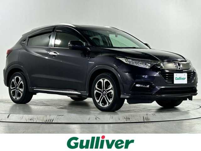 ホンダ ヴェゼル ハイブリッド Z ホンダセンシング 佐賀県 2020(令2)年 2.9万km ルーセブラックM 純正７インチナビ/（フルセグTV/CD/DVD/Bluetooth//USB/SD録音）/バックカメラ/衝突被害軽減ブレーキ/レーンキープアシスト/シートヒーター/ハーフレザーシート/パドルシフト/レーダークルーズコントロール/純正１７インチアルミホイール/ＬＥＤヘッドライト/オートライト/フォグライト/純正フロアマット/ビルトインＥＴＣ/スマートキー/スペアキー×１/電子パーキングブレーキ/ステアリングリモコン/横滑り防止装置/盗難防止装置