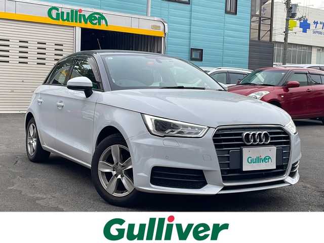 アウディ Ａ１ SB 1．0TFSI スポーツ 道央・札幌 2018(平30)年 1.7万km 白 純正ナビ(TV、BT、CD、DVD、FM、AM)/ステアリングスイッチ/クリアランスソナー/コーナーセンサー/シートヒーター前席/横滑り防止/オートライト/ドライブレコーダー/純正ドアバイザー/電格ミラー/プッシュスタート