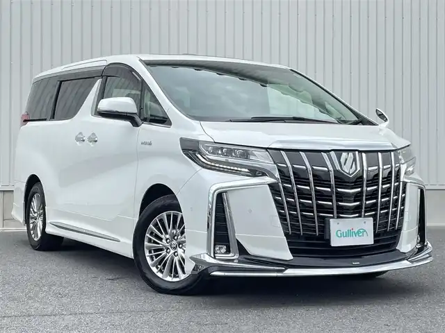 トヨタ アルファードハイブリット SR Cパッケージ 群馬県 2019(令1)年 6.2万km ホワイトパールクリスタルシャイン ワンオーナー/メーカーオプションナビ/CD/DVD/BTオーディオ/SD/USB/AUX/MSV/HDMI/フルセグTV/JBLプレミアムサウンドシステム/ツインムーンルーフ/Toyota Safety Sense/・PCS(プリクラッシュセーフティ)/・LTA(レーントレーシングアシスト)/・オートマチックハイビーム/・レーダークルーズコントロール/バックカメラ/パワーバックドア/両側パワースライドドア/純正フリップダウンモニター/ビルトインETC　Ver2.0/レザーシート/パワーシート(運転席/助手席)/メモリーシート(運転席)/シートヒータ(全席)/エアーシート(運転席/助手席)/ステアリングヒーター/オットマン/プッシュスタート/スマートキー/スペアキー1本/純正17インチアルミホイール