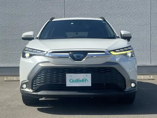 トヨタ カローラ クロス ハイブリッド Z 秋田県 2022(令4)年 7.1万km プラチナホワイトパールマイカ ４WD/衝突軽減システム/LEDヘッドライト/純正メモリナビ/フルセグ/バックカメラ/トヨタ純正18インチアルミ/スマートキー/アイドリングストップ/プッシュスタート/クルーズコントロール追従走行有/オートマチックハイビーム/レーンキープアシスト/コーナーセンサー/ステアリングスイッチ/電動パーキングブレーキ/ブレーキホールド機能/電動リアゲート/ドライブレコーダー/運転席パワーシート/前席シートヒーター/ETC/ルーフレール/純正フロアマット/純正ドアバイザー/オートライト/オートエアコン/パワーステアリング/パワーウィンドウ/ヘッドライトレベライザー/横滑り防止/盗難防止装置/寒冷地仕様/電動格納ウィンカーミラー/保証書/取扱説明書/記録簿/スペアキー1本有