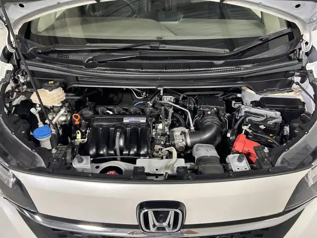 ホンダ フリード ハイブリット G ホンダセンシング 佐賀県 2022(令4)年 5.2万km プラチナホワイトパール 純正７型ナビ/(TV/CD/DVD/Bluetooth)/衝突被害軽減ブレーキ/バックカメラ/前後ドライブレコーダー/コーナーセンサー/レーンアシスト/追従型クルーズコントロール/両側パワースライドドア/シートヒーター/ハーフレザーシート/純正１５インチアルミホイール/純正フロアマット/ＬＥＤヘッドライト/オートライト/ビルトインETC/ドアバイザー/先行車発進告知機能/標識認識機能/横滑り防止機能/盗難防止装置