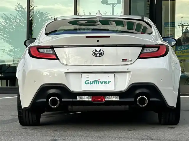 トヨタ ＧＲ８６ RZ 愛媛県 2024(令6)年 1.8万km クリスタルホワイトパール 純正メモリナビ/CD/DVD/BT/DTV/バックカメラ/ETC/ナビ連動ドライブレコーダー/レーダークルーズコントロール/レーンキープアシストシステム/プリクラッシュセーフティ/革巻きステアリング/ステアリングスイッチ/LEDヘッドライト/オートライト/フォグランプ/ドライブモード/純正フロアマット/純正18インチアルミホイール/プッシュスタート/スマートキー