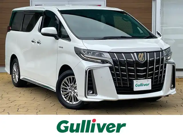 トヨタ アルファードハイブリット S タイプゴールド 宮崎県 2021(令3)年 5万km ホワイトパールクリスタルシャイン 純正ナビ/メモリナビ/ワンオーナー/バックカメラ/フリップダウンモニター/オットマン/クルーズコントロール/プッシュスタート/両側パワースライドドア/ETC/ブラインドスポットモニター/パーキングサポートブレーキ/デジタルインナーミラー/純正17インチアルミ