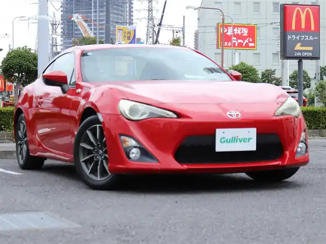 トヨタ ８６ G 神奈川県 2012(平24)年 5.7万km ライトニングレッド 6速マニュアル/ドラレコ/ETC/バックカメラ/社外メモリナビ/Buletoothオーディオ/DVD/CD/フルセグテレビ/純正16インチAW/純正フロアマット/純正ヘッドライト