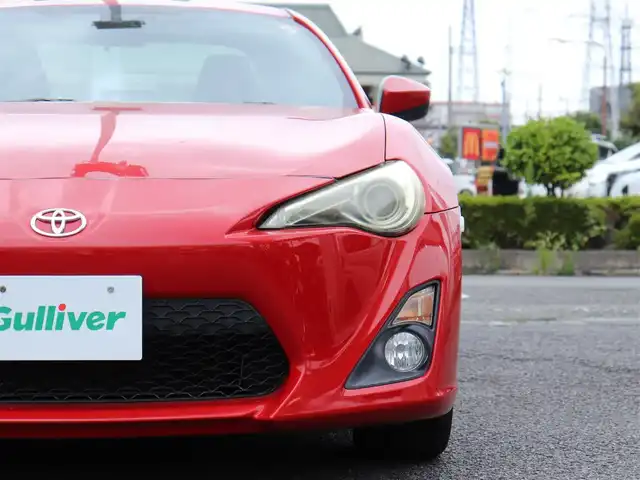 トヨタ ８６ G 神奈川県 2012(平24)年 5.7万km ライトニングレッド 6速マニュアル/ドラレコ/ETC/バックカメラ/社外メモリナビ/Buletoothオーディオ/DVD/CD/フルセグテレビ/純正16インチAW/純正フロアマット/純正ヘッドライト