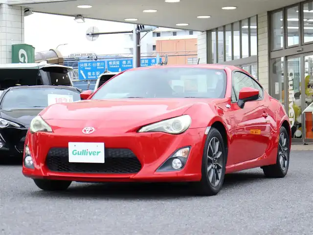トヨタ ８６ G 神奈川県 2012(平24)年 5.7万km ライトニングレッド 6速マニュアル/ドラレコ/ETC/バックカメラ/社外メモリナビ/Buletoothオーディオ/DVD/CD/フルセグテレビ/純正16インチAW/純正フロアマット/純正ヘッドライト