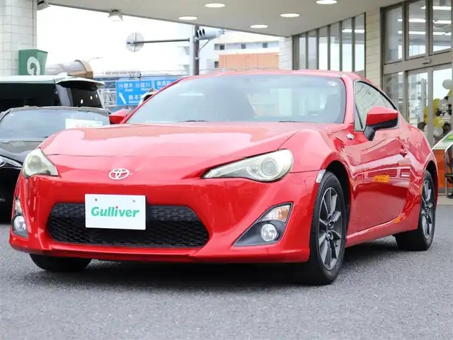 トヨタ ８６ G 神奈川県 2012(平24)年 5.7万km ライトニングレッド 6速マニュアル/ドラレコ/ETC/バックカメラ/社外メモリナビ/Buletoothオーディオ/DVD/CD/フルセグテレビ/純正16インチAW/純正フロアマット/純正ヘッドライト