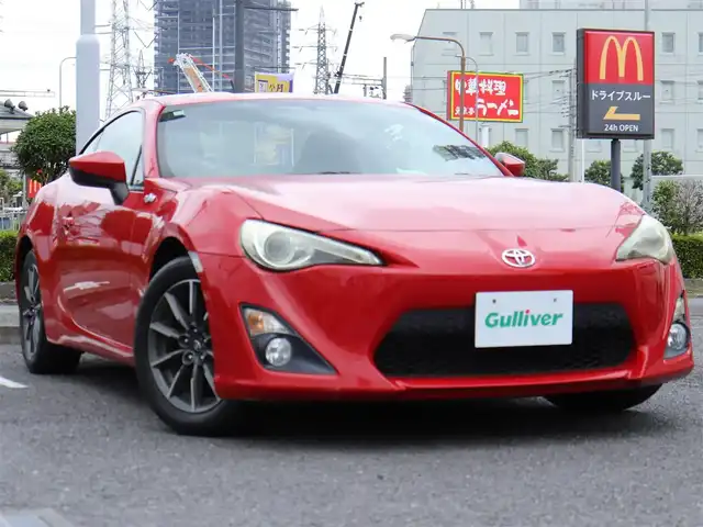 トヨタ ８６ G 神奈川県 2012(平24)年 5.7万km ライトニングレッド 6速マニュアル/ドラレコ/ETC/バックカメラ/社外メモリナビ/Buletoothオーディオ/DVD/CD/フルセグテレビ/純正16インチAW/純正フロアマット/純正ヘッドライト