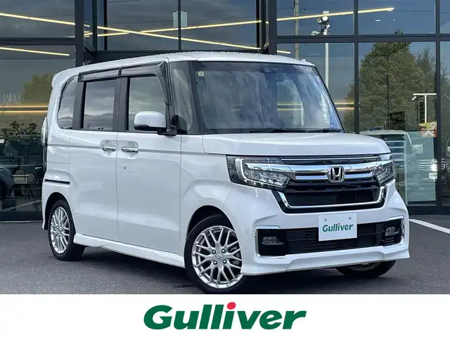 ホンダ Ｎ ＢＯＸ カスタム L ターボ 栃木県 2023(令5)年 1.3万km プラチナホワイトパール ワンオーナー/社外メモリナビ/　（CD・DVD・Bluetooth・USB）/フルセグTV/両側パワースライドドア/ホンダセンシング/アダプティブクルーズコントロール/前後コーナーセンサー/ハーフレザーシート/前席シートヒーター/LEDヘッドライト/LEDフォグライト/スマートキー×2/ETC/保証書/取扱説明書