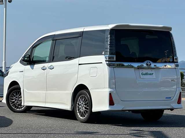 トヨタ ヴォクシー ハイブリッド ZS 煌 島根県 2017(平29)年 10.6万km ホワイトパールクリスタルシャイン トヨタセーフティセンス/アルパイン11インチナビ/CD/DVD/DTV/Bluetooth/バックカメラ/両側パワースライドドア /クルーズコントロール/シートヒーター /LEDオートライト/オートマチックハイビーム /LDA/ステアリングスイッチ/ドライブレコーダー/ビルトインETC/スマートキー/プッシュスタート /純正フロアマット/純正ドアバイザー