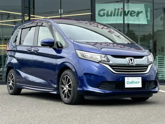 ホンダ フリード ハイブリット G 鹿児島県 2016(平28)年 7.9万km コバルトブルーパール サイドリフトアップシート車/社外ＳＤナビ/　　CD/DVD/BT/フルセグ/バックカメラ/両側パワースライドドア/クルーズコントロール/LEDヘッドライト/社外15インチアルミホイール/スマートキー/純正ビルトインETC/ステアリングスイッチ