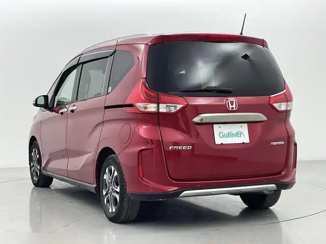ホンダ フリード ハイブリット クロスター 熊本県 2022(令4)年 4.8万km プレミアムクリスタルレッドM 純正前後ドライブレコーダー　/純正フリップダウンモニター/純正9インチナビ（ＣＤ・ＤＶＤ・フルセグ・ＢＴ・ＳＤ・ApplCarPlay）/バックカメラ　/ビルトインＥＴＣ　/両側パワースライドドア　/後ろのみクリアランスソナー　/前席シートヒーター　/レーダークルーズコントロール/衝突軽減ブレーキ/先行車発進お知らせ機能/路外逸脱制御機能/標識認識機能/ハーフレザーシート/純正フロアマット/純正１５インチAW/オートライト/LEDヘッドライト/フォグランプ/スマートキー/プッシュスタート/スペアキー1本