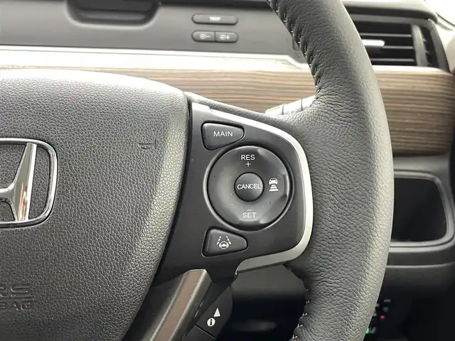 ホンダ フリード ハイブリット クロスター 熊本県 2022(令4)年 4.8万km プレミアムクリスタルレッドM 純正前後ドライブレコーダー　/純正フリップダウンモニター/純正9インチナビ（ＣＤ・ＤＶＤ・フルセグ・ＢＴ・ＳＤ・ApplCarPlay）/バックカメラ　/ビルトインＥＴＣ　/両側パワースライドドア　/後ろのみクリアランスソナー　/前席シートヒーター　/レーダークルーズコントロール/衝突軽減ブレーキ/先行車発進お知らせ機能/路外逸脱制御機能/標識認識機能/ハーフレザーシート/純正フロアマット/純正１５インチAW/オートライト/LEDヘッドライト/フォグランプ/スマートキー/プッシュスタート/スペアキー1本