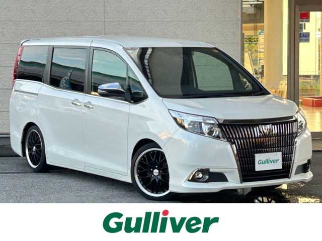 トヨタ エスクァイア Gi ブラックテーラード 兵庫県 2017(平29)年 3.9万km ホワイトパールクリスタルシャイン ワンオーナー/純正ナビ/（CD/DVD/BT)/ETC/フルセグTV/衝突軽減ブレーキ/クルーズコントロール/両側パワースライドドア/フリップダウンモニター/MTモード付AT/レザーシート/シートヒーター/スマートキー/純正フロアマット/社外アルミ18インチ/取扱説明書・保証書