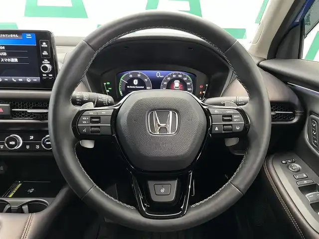 ホンダ ＺＲ－Ｖ ハイブリッド e:HEV Z 鹿児島県 2024(令6)年 1.4万km プレミアムクリスタルブルークリスタル 禁煙車/純正ナビ/(Ｂｌｕｅｔｏｏｔｈ/フルセグTV)/ホンダセンシング/　・衝突軽減ブレーキ（CMBS）/　・誤発進抑制機能/　・後方誤発進抑制機能/　・近距離衝突軽減ブレーキ/　・歩行者事故低減ステアリング/　・路外逸脱抑制機能/　・渋滞追従機能付アダプティブクルーズコントロール（ACC）/　・車線維持支援システム（LKAS）/　・トラフィックジャムアシスト（渋滞運転支援機能）/　・先行車発進お知らせ機能/　・標識認識機能/　・アダプティブドライビングビーム/　・ブラインドスポットインフォメーション/　・パーキングセンサーシステム/置くだけ充電/前席シートヒーター/BOSEプレミアムサウンドシステム/ステアリングヒーター/パワーテールゲート/ETC