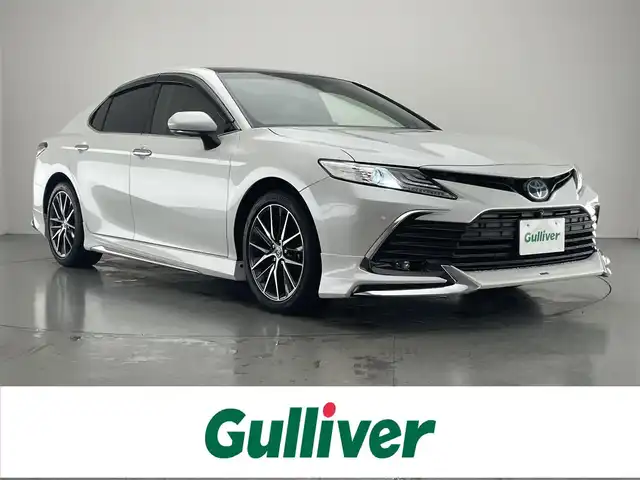 トヨタ カムリ G レザーパッケージ 愛知県 2021(令3)年 1.6万km プラチナホワイトパールマイカ メーカーナビ　純正９イ型DA　全方位カメラ　フルセグTV　パノラマムーンルーフ　モデリスタ　BSM　HUD　JBLサウンド　黒革シート　追従クルコン　ETC2.0　LEDオートライト　フォグ　衝突軽減　車線逸脱　禁煙車