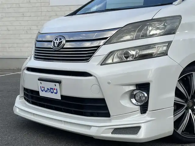 トヨタ ヴェルファイア 2．4Z 佐賀県 2012(平24)年 8.3万km ホワイトパールクリスタルシャイン (株)IDOMが運営する【じしゃロン佐賀店】の自社ローン対象車両になります。こちらは現金ご利用時の価格です。自社ローンご希望の方は別途その旨お申付け下さい。/アルパイン　ビックX９インチ/メモリーナビ/CD/DVD/SD/BT/フルセグ/アルパインフリップダウンモニター/前方ドラレコ/バックカメラ/両側パワーパワースライドドア/バックドアイージークロージャー/ローダウン/社外アルミ　AME２０インチ/社外テール/社外マフラー(rosso modello)/HIDヘッドライト/社外LEDフォグ/社外カーテシイルミ/社外ダッシュマット/社外USB充電ポート×２/社外シートカバー(clazzio)/7人乗り/オットマンシート/シフトゲートイルミ/コーナーセンサー/ウッドコンビハンドル/オートライト/ナノイーエアコン/リアフィルム/ドアバイザー/スマートキー×２/新車時保証書/取扱説明書/ナビ取扱説明書/ドラレコ取扱説明書