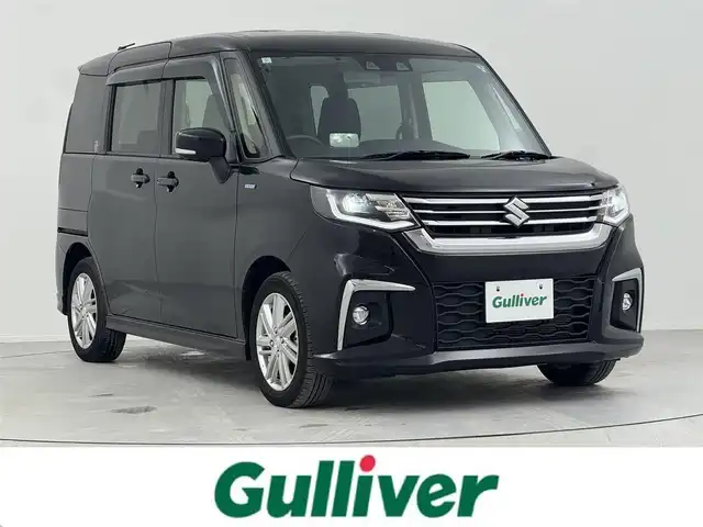 スズキ ソリオ HV MZ 熊本県 2024(令6)年 1.7万km スーパーブラックパール 社外ナビ/（CD/DVD/BT/AM/FM/ipad）/フルセグ/バックカメラ/D/Nシートヒーター/追従型クルーズコントロール/両側パワースライド/アイドリングストップ/コーナーセンサー/横滑り防止装置/レーンアシスト/衝突軽減システム/ドアバイザー/ETC/純正フロアマット/純正AW15インチ