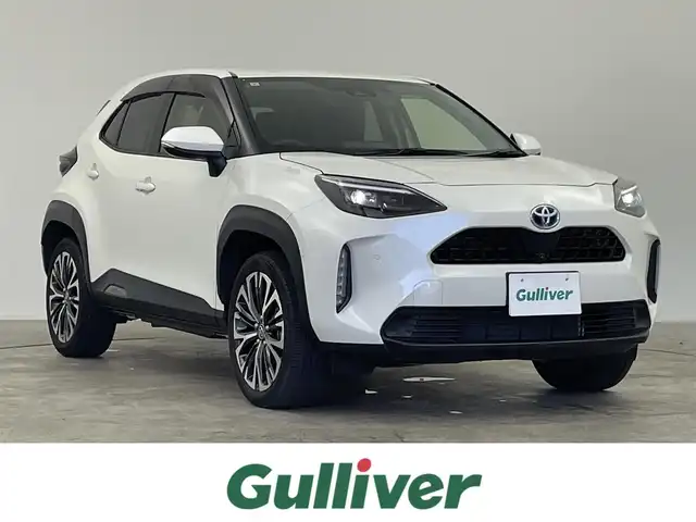 トヨタ ヤリスクロス ハイブリッド Z 千葉県 2021(令3)年 1.6万km ホワイトパールクリスタルシャイン セーフティセンス（衝突回避支援パッケージ）/・プリクラッシュセーフティ/・レーンディパーチャーアラート/・オートマチックハイビーム/・ドライバー異常時対応システム/・発進遅れ告知機能/・レーントレーシングアシスト/・レーダークルーズコントロール/・ロードサインアシスト/ブラインドスポットモニター/・安心降車アシスト/・パーキングサポートブレーキ/（前後方静止物／後方接近車両）/純正8インチディスプレイオーディオ/・Bluetooth/・メモリーナビ/・Miracast/・パノラミックビューモニター/パワーバックドア/スマートキー/パワーシート/シートヒーター/LEDヘッドライト/ステアリングヒーター/ビルトインETC2.0