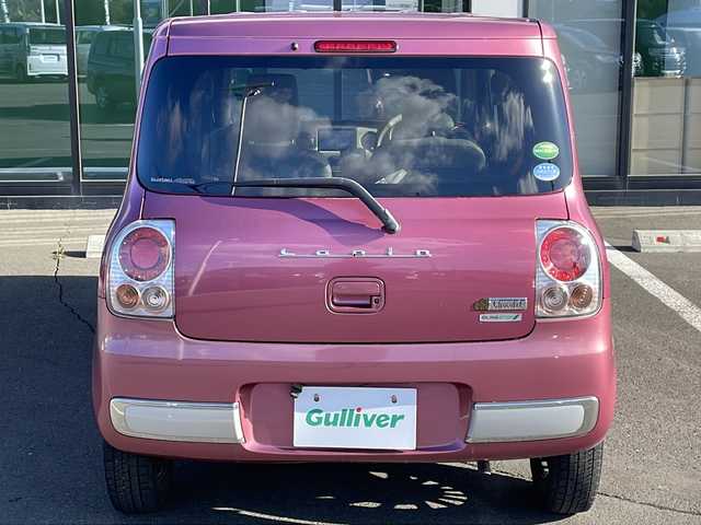 スズキ ラパン ショコラ X 道東・釧路十勝 2014(平26)年 10.9万km カシスピンクパールメタリック ・4WD/・社外SDナビ/（ラジオ CD ワンセグ USB）/・バックカメラ/・社外エンジンスターター/・HIDヘッドライト/・オートライト/・ヘッドライトレベライザー/・革巻きステアリング/・運転席のみシートヒーター/・アイドリングストップ/・電格ウィンカーミラー/・ドアバイザー/・スマートキー/・プッシュスタート/・鉄ホイール付夏用タイヤ積込