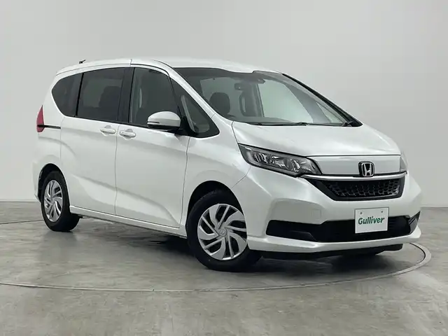 ホンダ フリード G 群馬県 2023(令5)年 1.8万km プラチナホワイトパール 衝突被害軽減ブレーキ ナビ　バックカメラ　両側電動スライドドア　アダプティブクルーズコントロール　アイドリングストップ　シートヒーター　オートライト　ステアリングリモコン　スマートキー　禁煙車