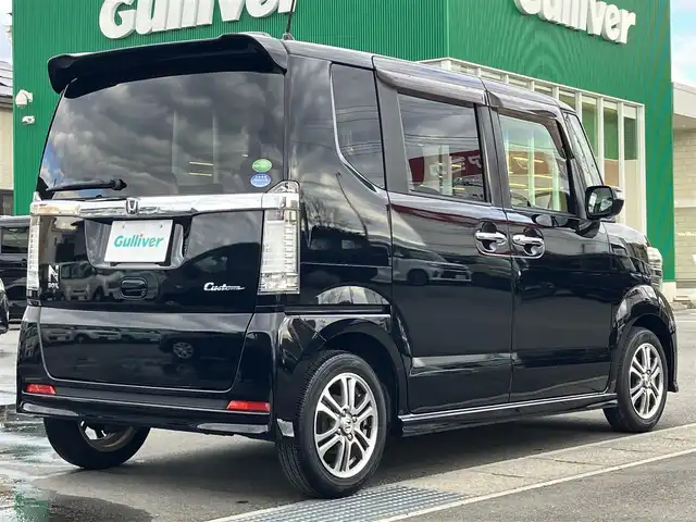 ホンダ Ｎ ＢＯＸ カスタム SSパッケージ 静岡県 2014(平26)年 6.9万km スマートブラック エンジンスタートボタン/パワーステアリング/パワーウィンドウ/アイドリングストップ/スマートキー/スペアキー1本/オートエアコン/取扱説明書/ETC/メモリナビ/ドライブレコーダー/ベンチシート/布シート/両側パワスラ/フロアマット/純正アルミホイール/ABS/横滑り防止装置/オートライト/キセノン/Ｗ+サイドエアバッグ/衝突軽減システム/カーテンエアバッグ