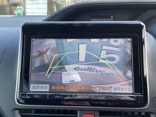 トヨタ ノア ハイブリッド X 長野県 2014(平26)年 10万km ダークシェリーマイカM 純正SDナビ/・Bluetooth/CD/DVD/TV/バックカメラ/フリップダウンモニター/純正ETC/社外ドライブレコーダー前方/ウォークスルー/純正フロアマット/両側パワースライド/社外15インチAW/LEDオートライト/スマートキー/純正AWノーマルタイヤ積み込み/電格ミラー/取り扱い説明書/保証書