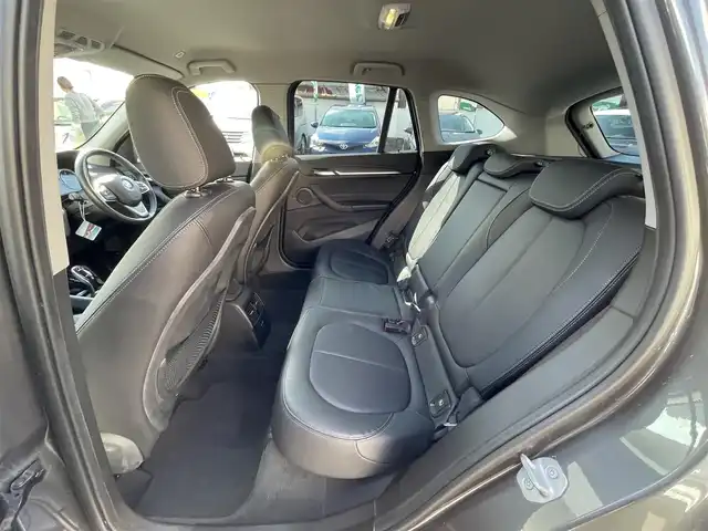 ＢＭＷ Ｘ１ xDrive 18d xライン 岡山県 2019(令1)年 5.7万km ミネラルグレー 登録時走行距離56595キロ/純正10.25インチナビ/AM/FM/Bluetooth/TV/インテリジェントセーフテイ/・アクティブクルーズコントロール/・衝突回避ブレーキ/・前車接近警告機能/コーナーセンサー/バックカメラ/電動リアゲート/シートヒーター/パワーシート/純正１９インチAW/LEDヘッドライト/プッシュスタート/スマートキー/ETC